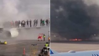 Aereo in fiamme durante atterraggio d’emergenza: passeggeri evacuano dalle ali